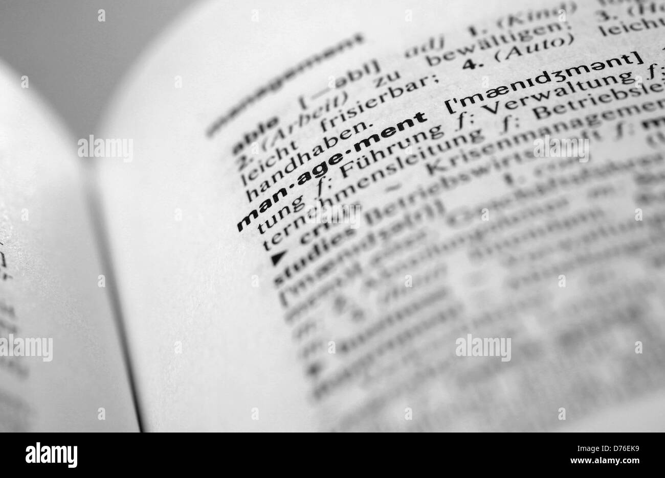 Management definition in English German dictionary Stock Photo