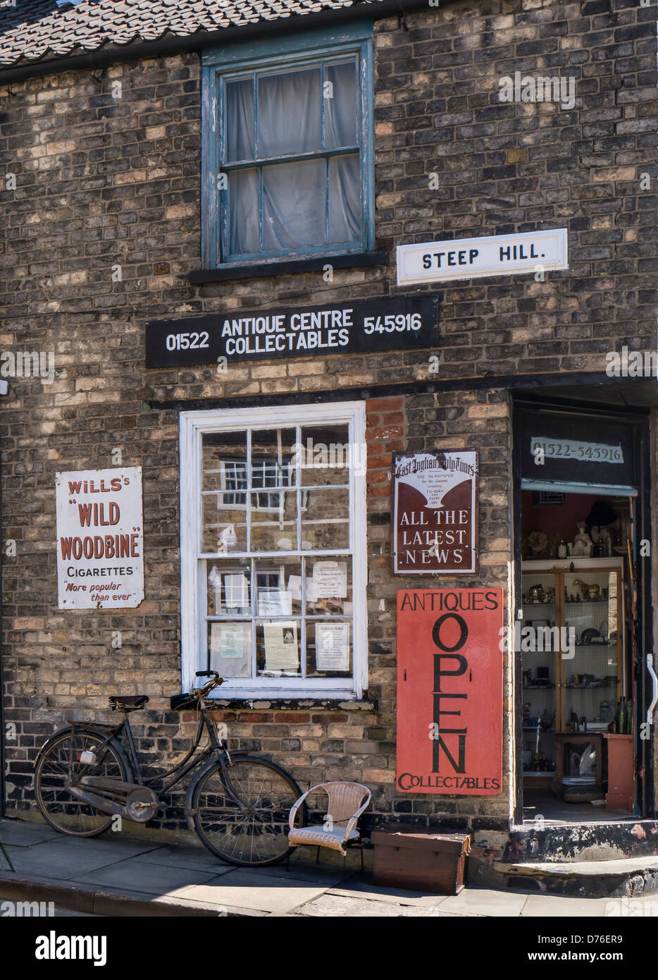 LINCOLN, UK - APRIL 20, 2013:  Exterior view of pretty Antique shop on Steep Hill Stock Photo