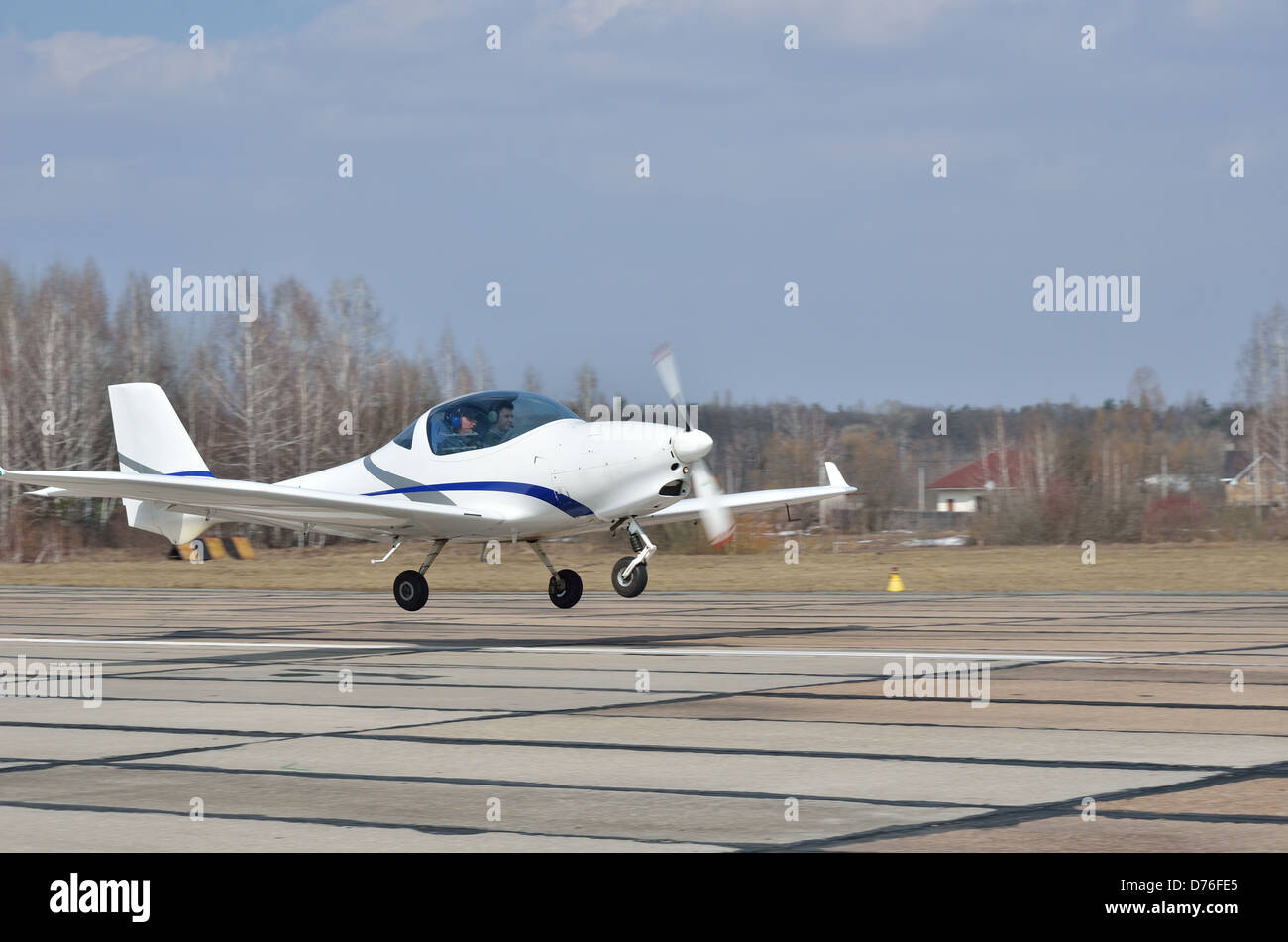 A modern light aircraft landing or taking off Stock Photo