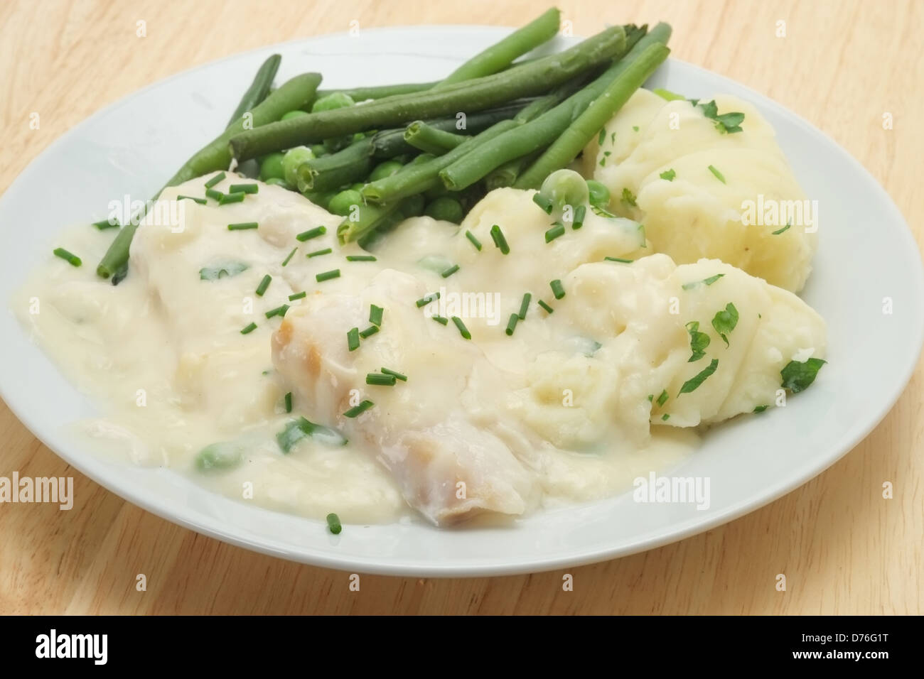 Cod Mornay with mashed potato, peas, green beans and a white cream