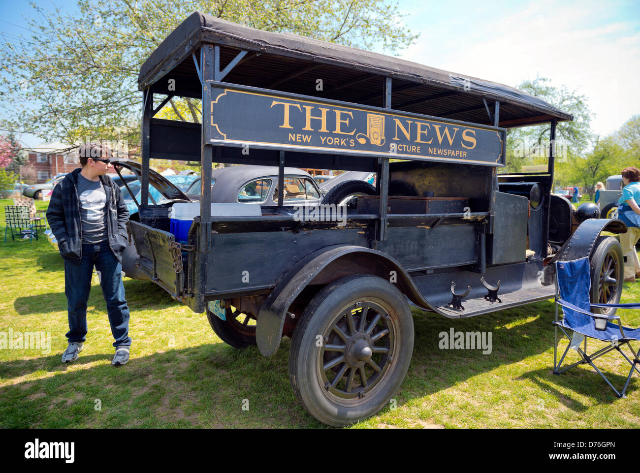 Floral Park, New York, U.S. April 28, 2013. This wood, black 1922 REO Speed Wagon Canopy Express Model F, which used to deliver THE NEWS  'New York's Picture Newspaper',' painted on its sides, is at the Antique Auto Show, where New York Antique Auto Club members exhibited their cars on the farmhouse grounds of Queens County Farm Museum. Credit: Ann E Parry/Alamy Live News Stock Photo