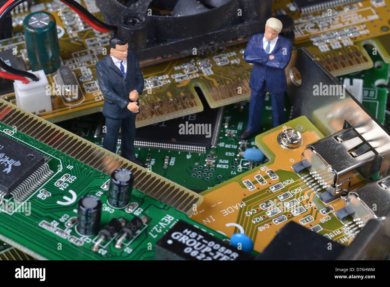 Electronics boards leading records Businessmen Stock Photo
