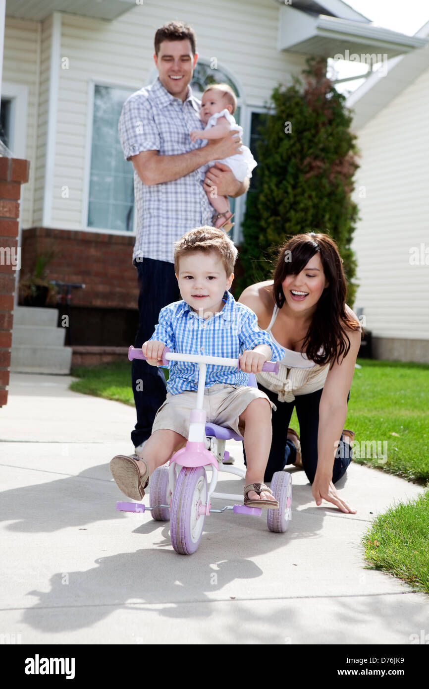 Cute Boy Riding Tricycle Stock Photo Alamy