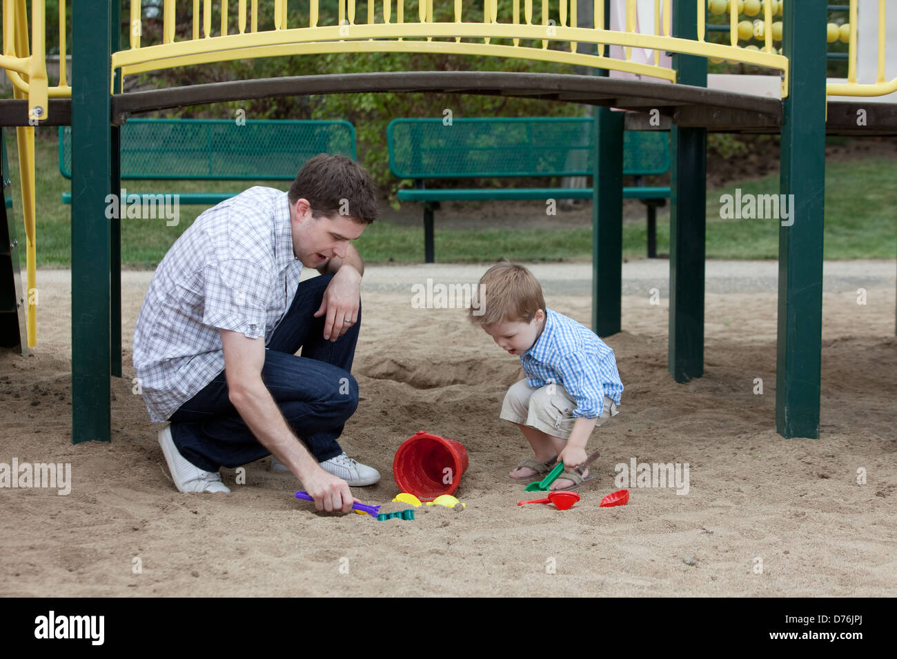 Father And Son Playing At Playground In Sand Stock Photo - Alamy