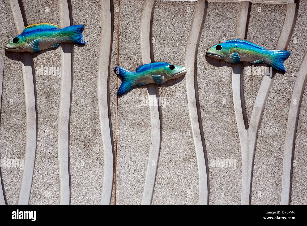 Fish sculptures on the exterior wall of the New York Aquarium on the boardwalk at Coney Island, Brooklyn, New York. Stock Photo