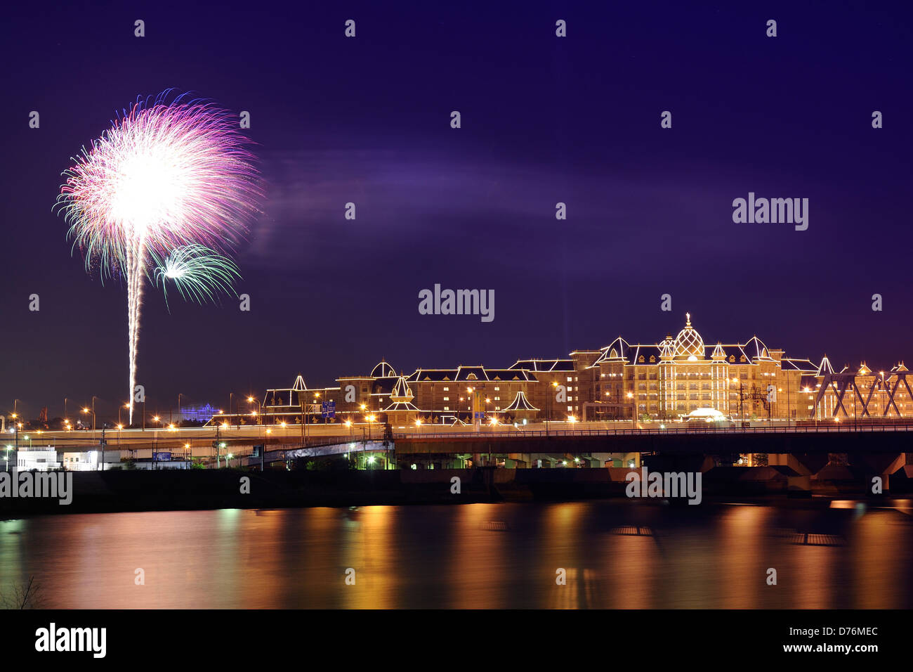 Tokyo, Japan - June 06, 2008 : night-time distant view to the Famous Tokyo Disneyland during everyday fireworks. Stock Photo