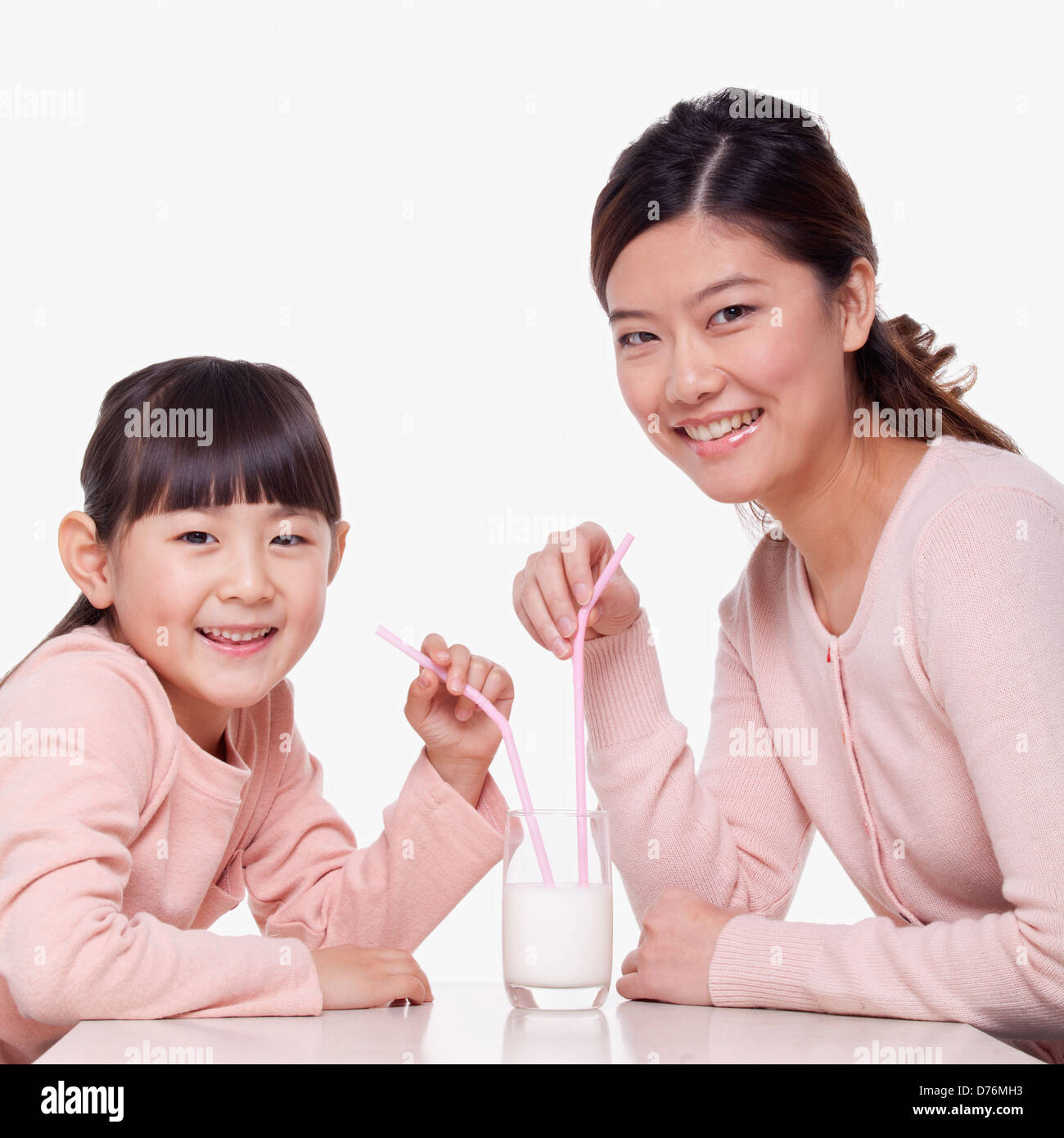 Brother And Sister Sharing Glass Of Milk High-Res Stock Photo - Getty Images