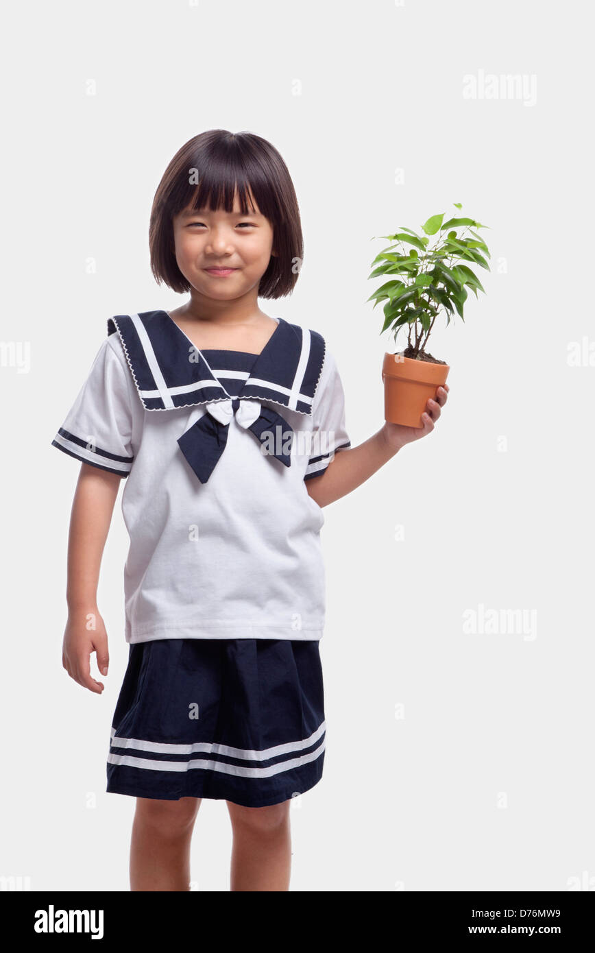 Girl Holding Potted Plant Stock Photo - Alamy