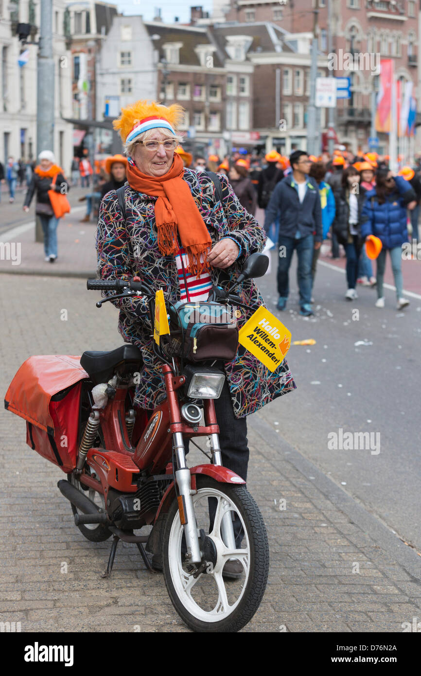 Amsterdam, The Netherlands. 30 April 2013. Dutch people and tourists celebrate the coronation of King Willem-Alexander in Amsterdam the day his mother Queen Beatrix is abdicated. Photo: Nick Savage/Alamy Live News Stock Photo