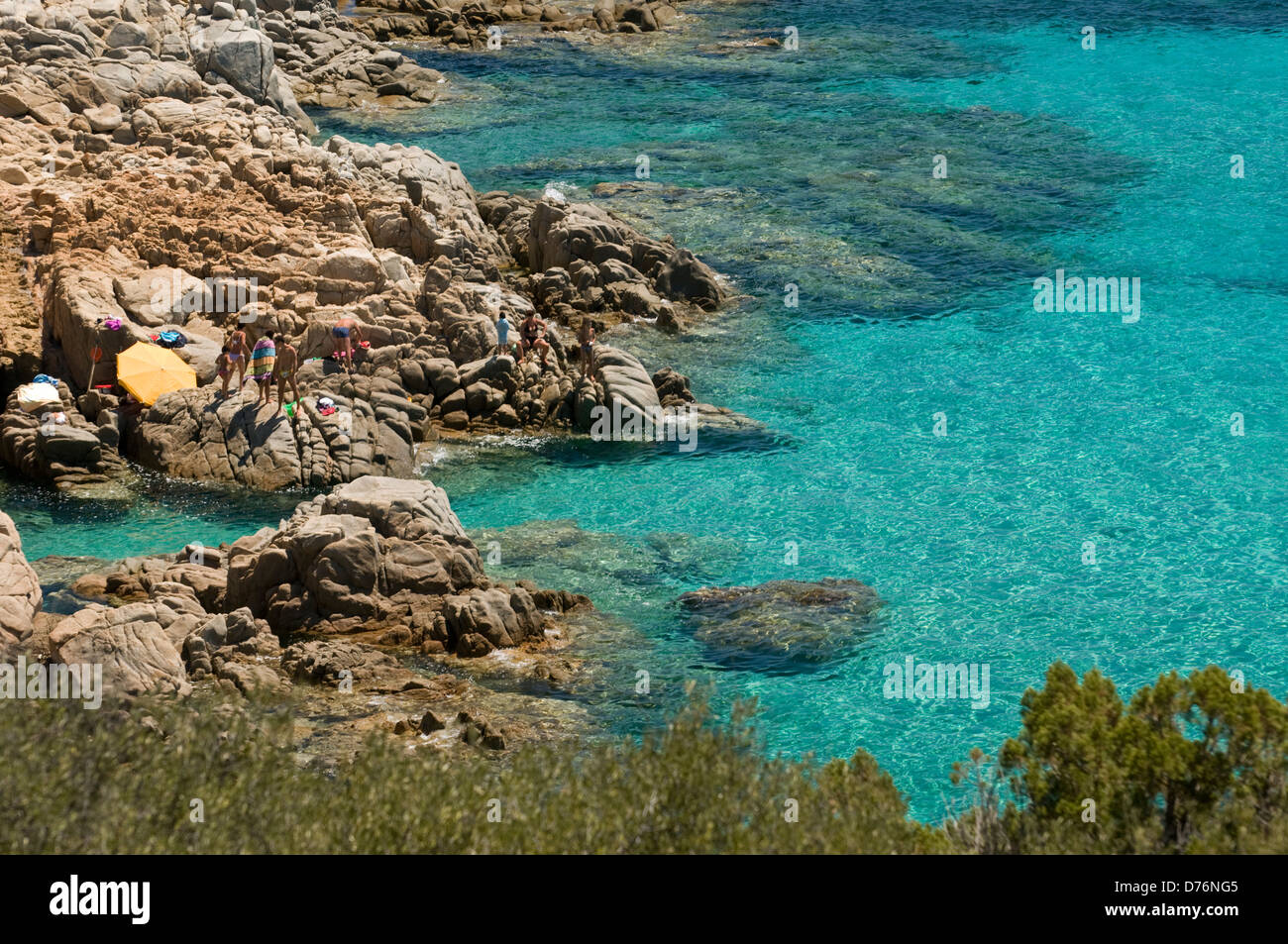 Tourist enjoy the blue sea on the coast near Tuerredda beach, Teulada, Cagliari, Sardinia, Italy Stock Photo