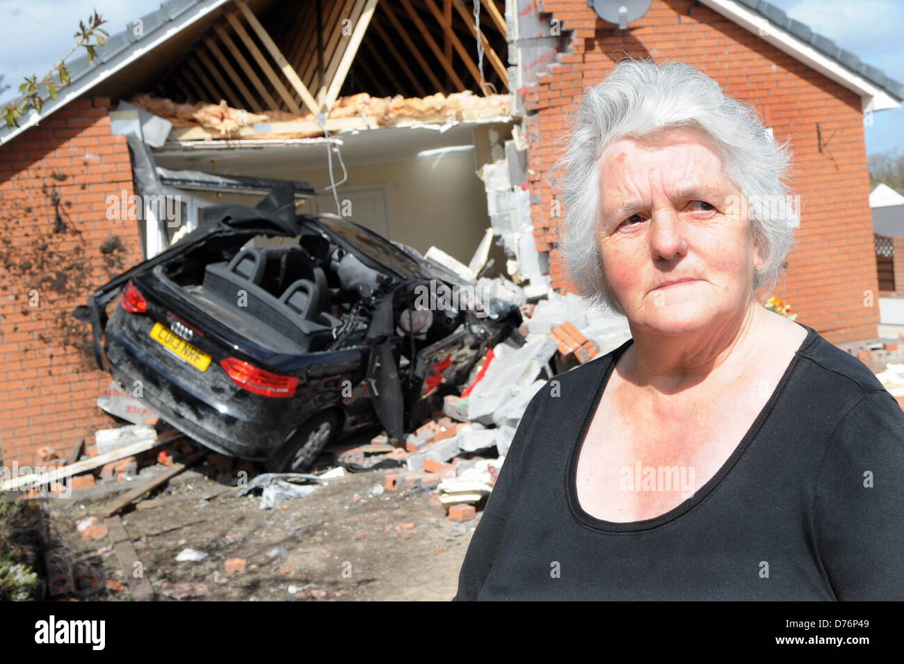 Gowerton, UK. 29th April 2013  Home owner Marianne Heath at the scene of an accident in which her bungalow, in Gowerton, near Swansea, UK, was partially destroyed when a brand new Audi convertible car plunged into the lounge whilst she was having breakfast in the kitchen. Credit:  D Legakis / Alamy Live News Stock Photo