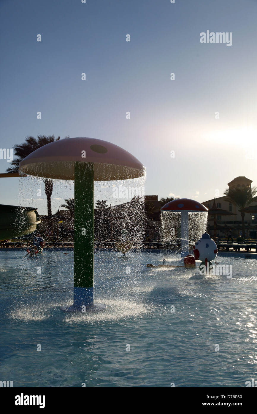 Decorative mushroom with shower in the water park Stock Photo - Alamy