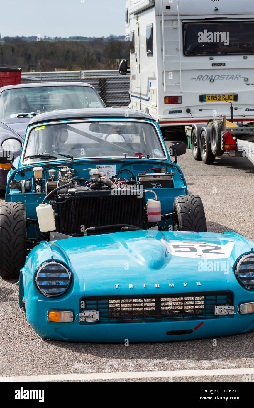 The Triumph Spitfire of John Williams with the bonnet off in the paddock at  the 2013 CSCC Snetterton meeting, Norfolk, UK Stock Photo - Alamy