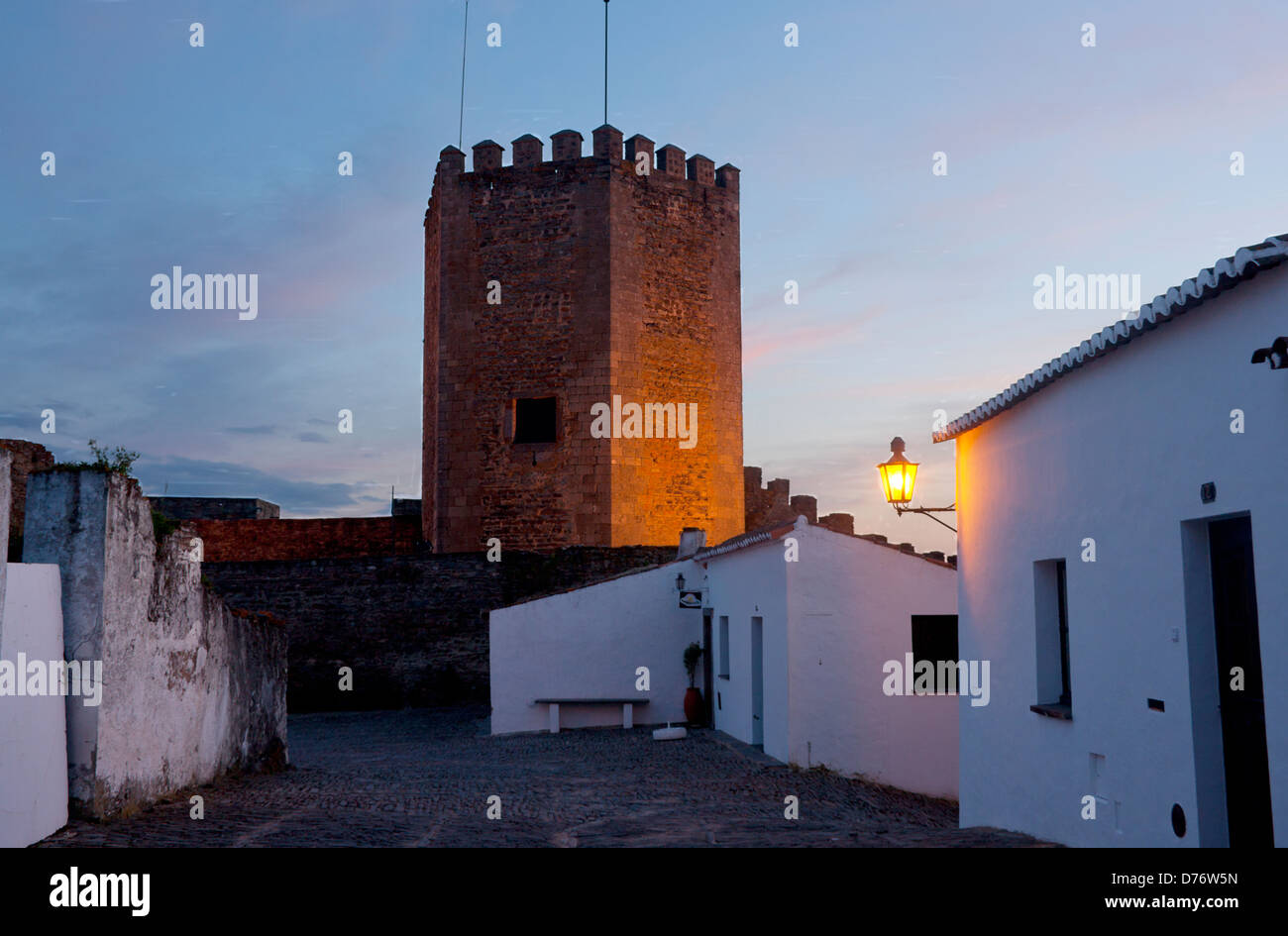 Castle and cobbled street at dusk / twilight / sunset / evening Monsaraz village Alentejo Portugal Stock Photo