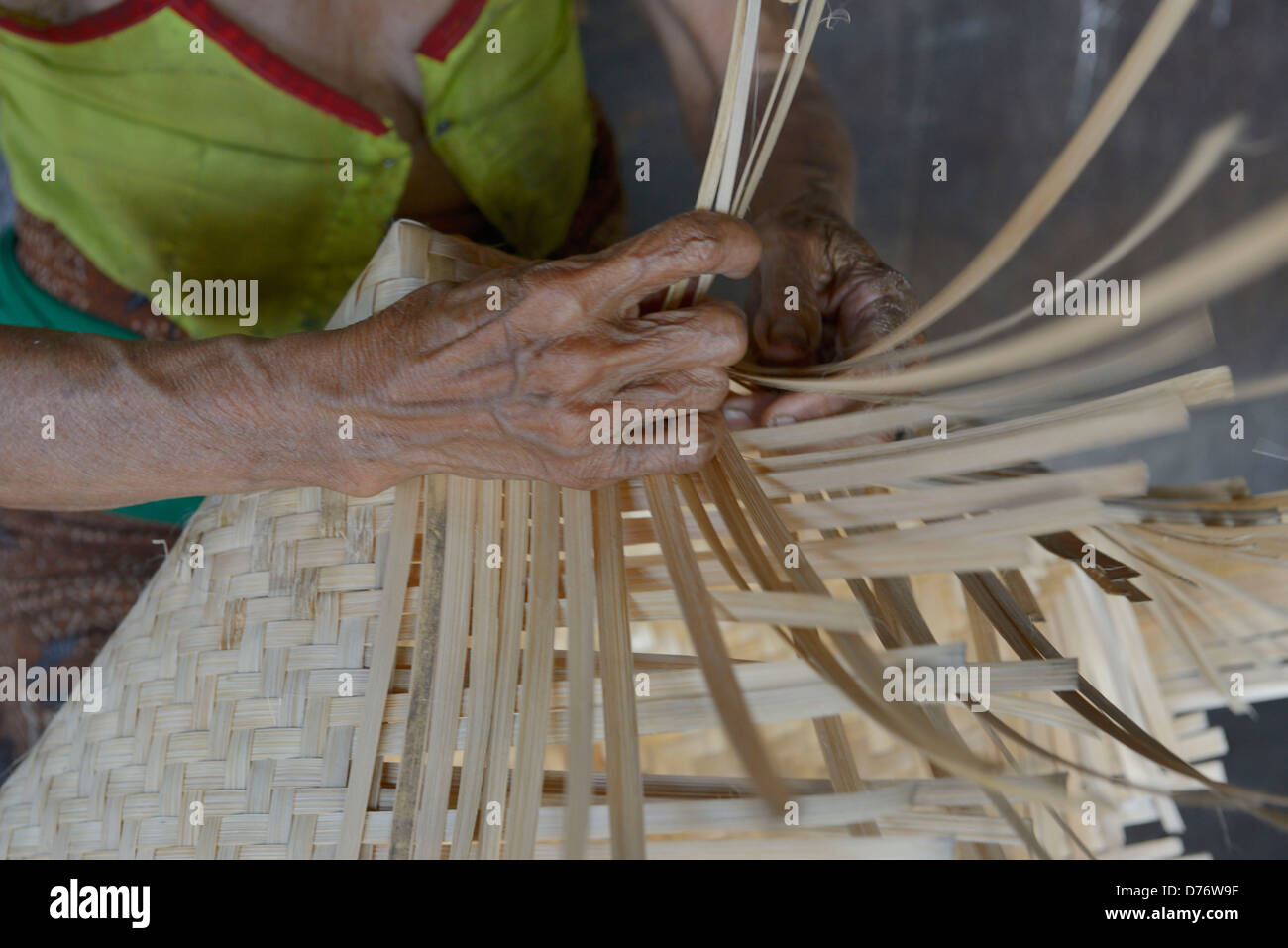 Asia Indonesia Bali Village of Sidatapa, detail of an elderly woman making basketry Stock Photo