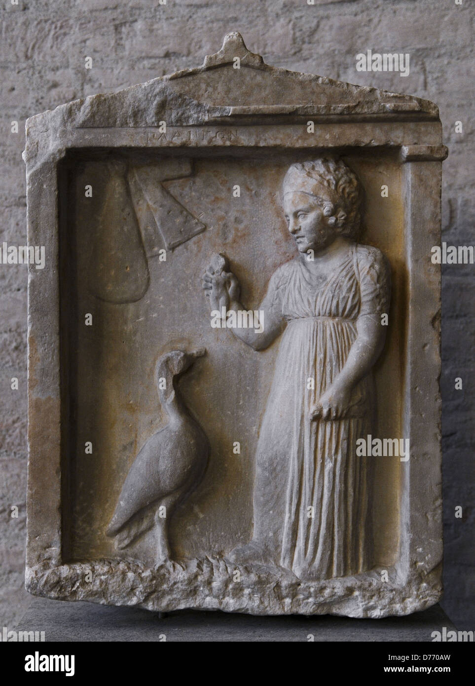 Greek art. Grave of Plangon 'doll'. About 310 BC. The girl holds a bird and a doll. Glyptothek. Munich. Germany. Stock Photo