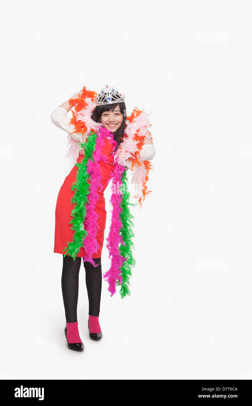 Girl wearing feather boas and tiara Stock Photo Alamy