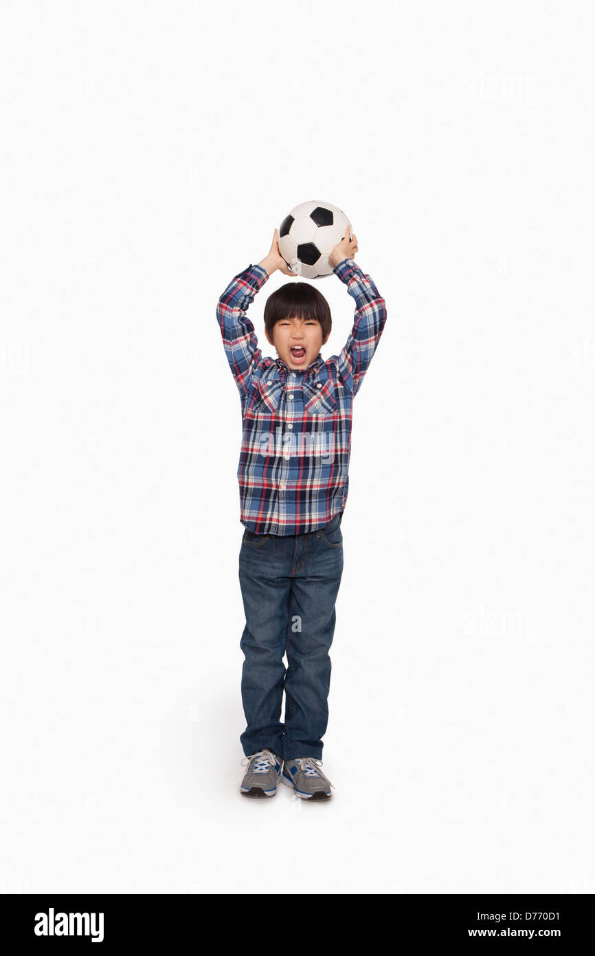 Boy ready to throw football Stock Photo Alamy
