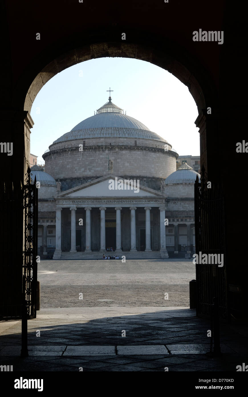 Naples. Italy. View through the Palazzo Reale Royal palace courtyard arched entrance to the church of San Francesco di Paola. Stock Photo