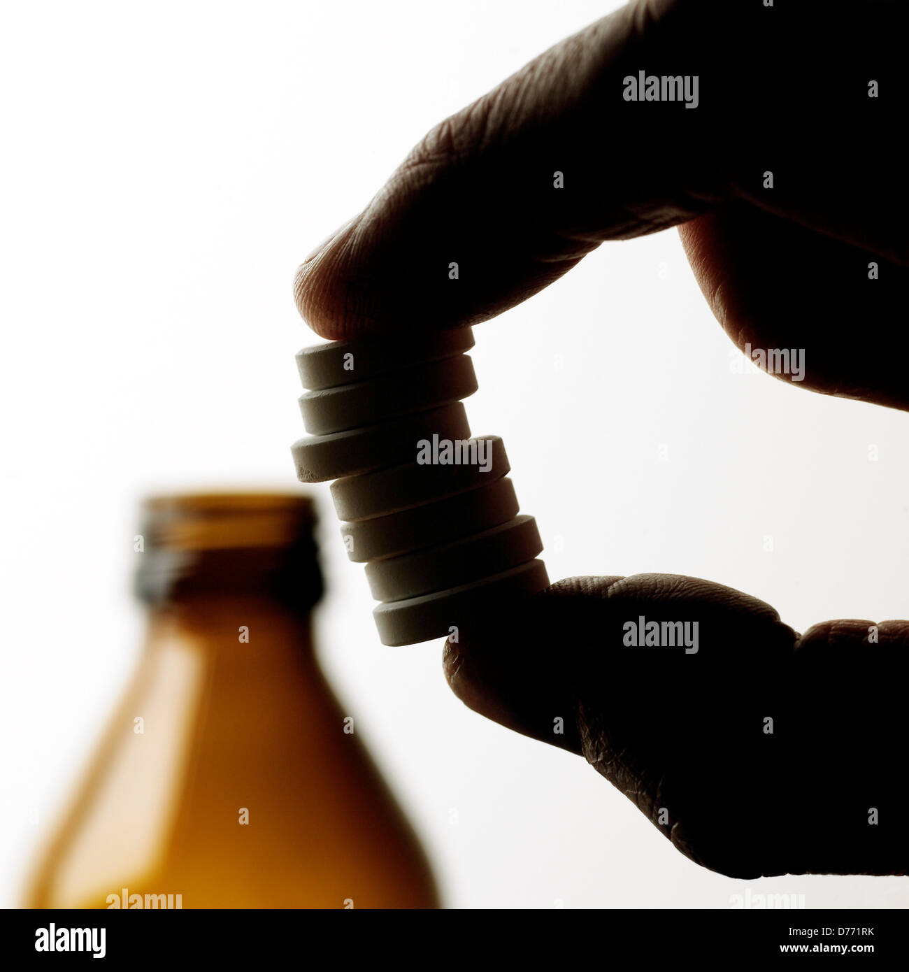 Opened pill bottle hand holding stack tablets Stock Photo Alamy