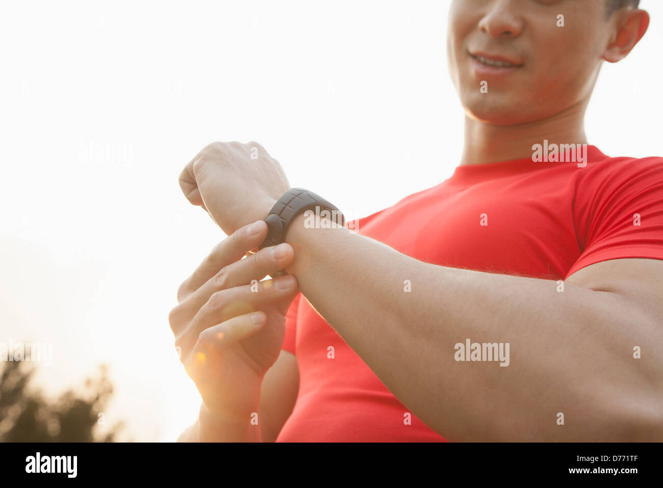Muscular Man Checking His Watch Stock Photo