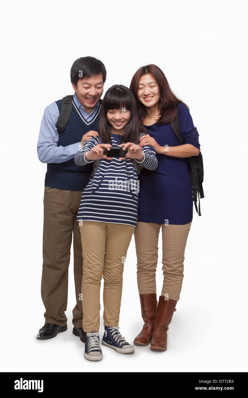 Family taking picture with digital camera Stock Photo