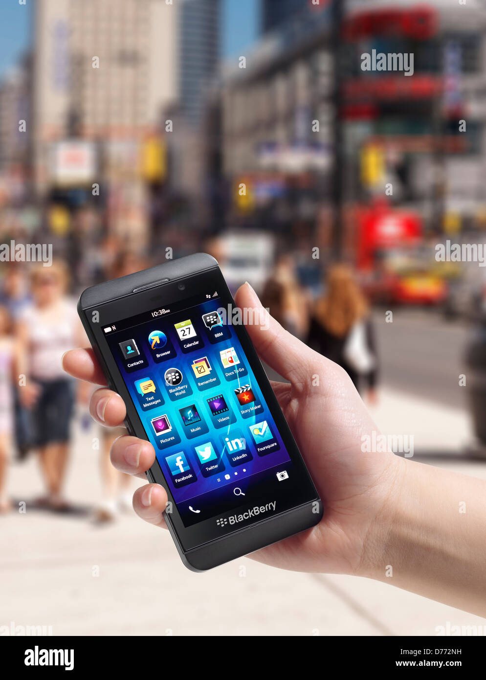 Hand with Blackberry Z10 smartphone outside on a city street. Toronto, Canada. Stock Photo