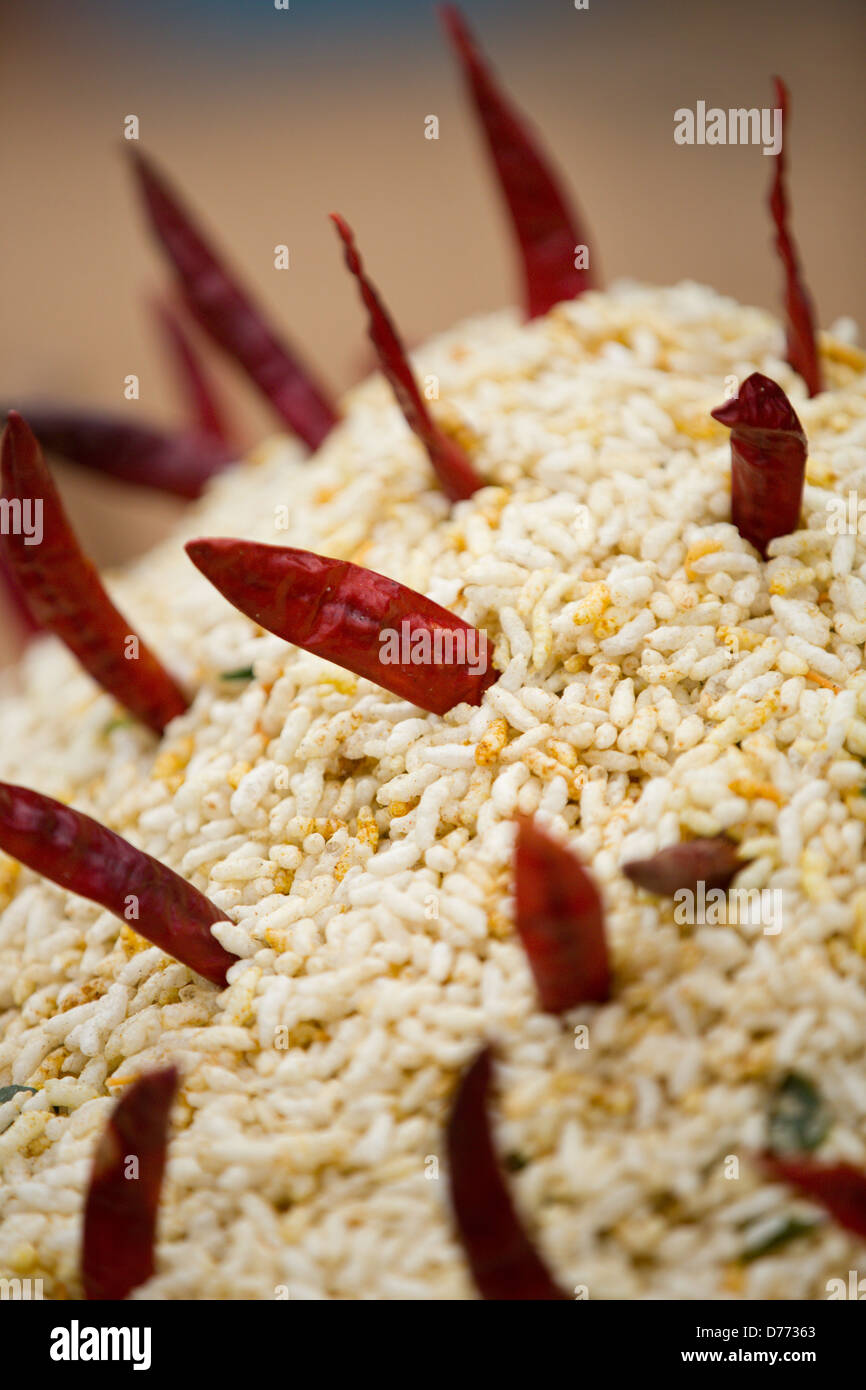 Chili peppers on popped rice India Stock Photo Alamy