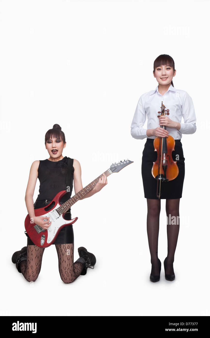 Rock star and violin player, opposite Stock Photo