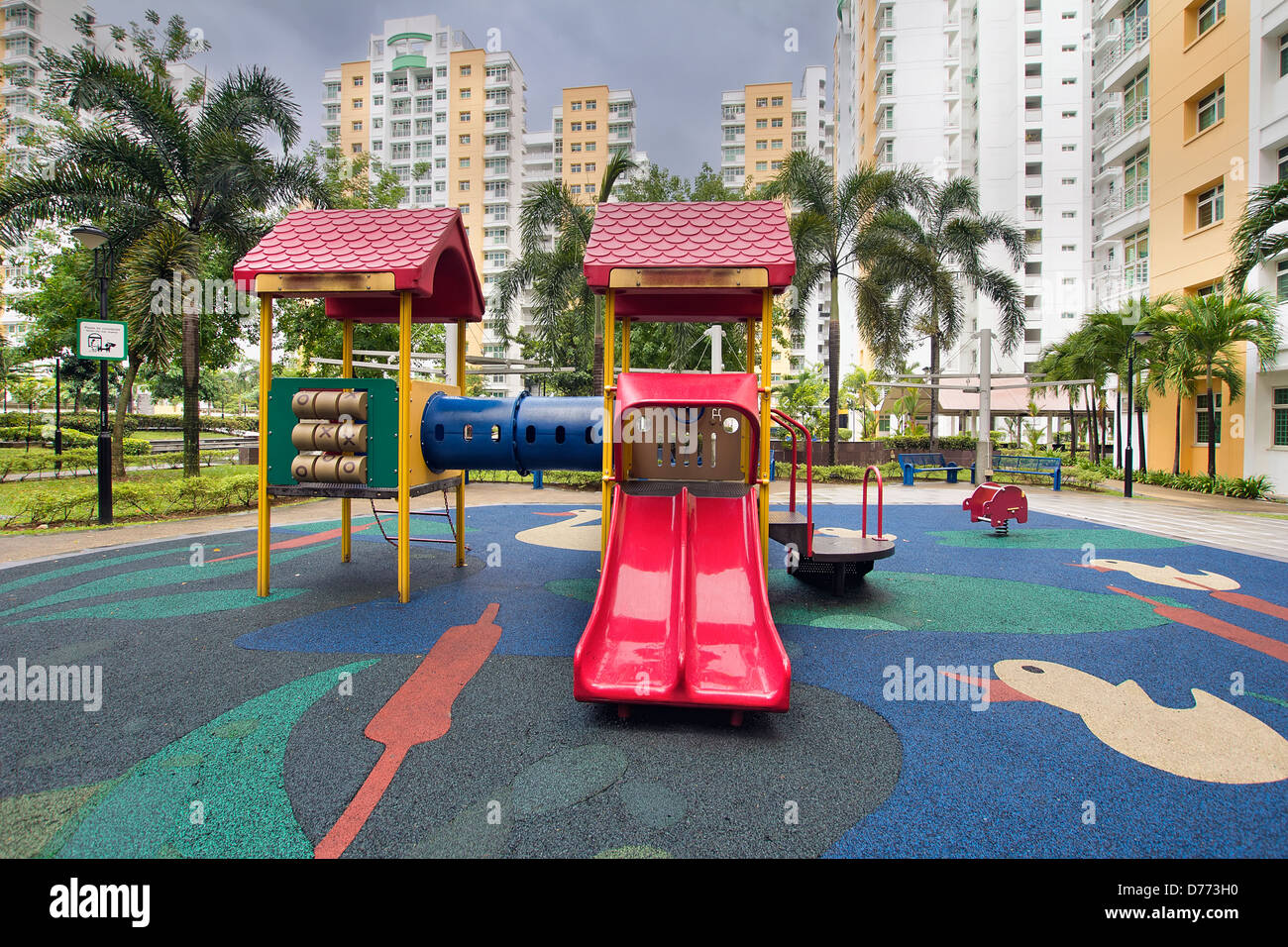 Rubber Ducky Theme Children Playground with Red Slides in Public Housing in Singapore Punggol District Stock Photo