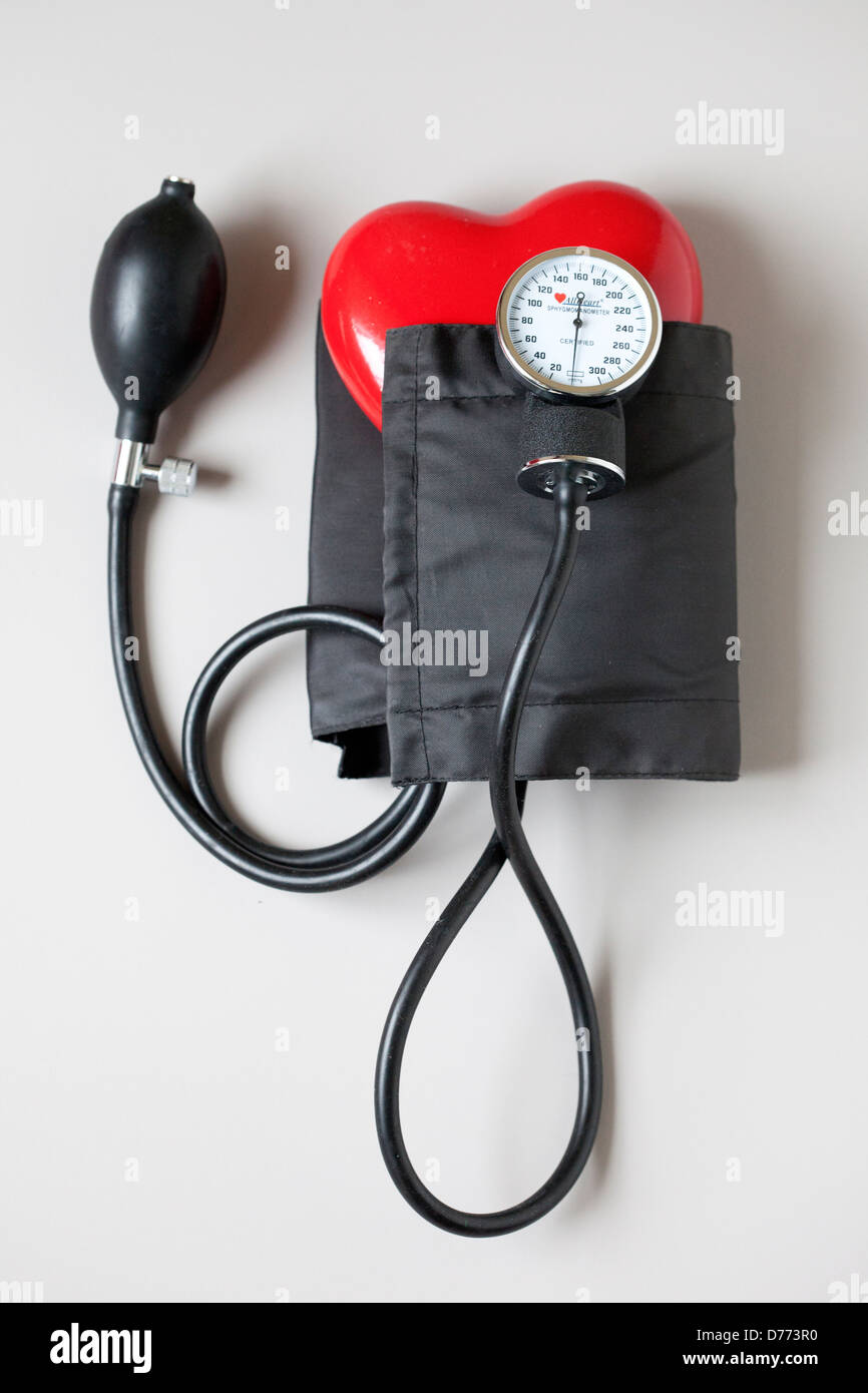 heart with blood pressure cuff Stock Photo