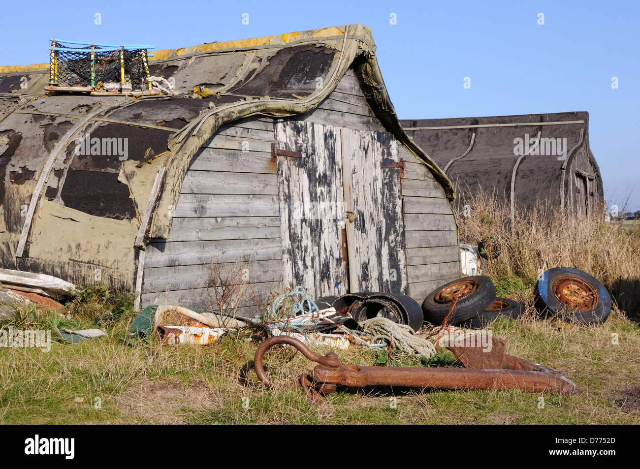 Upturned herring boats used as huts on Holy Island Stock Photo Alamy