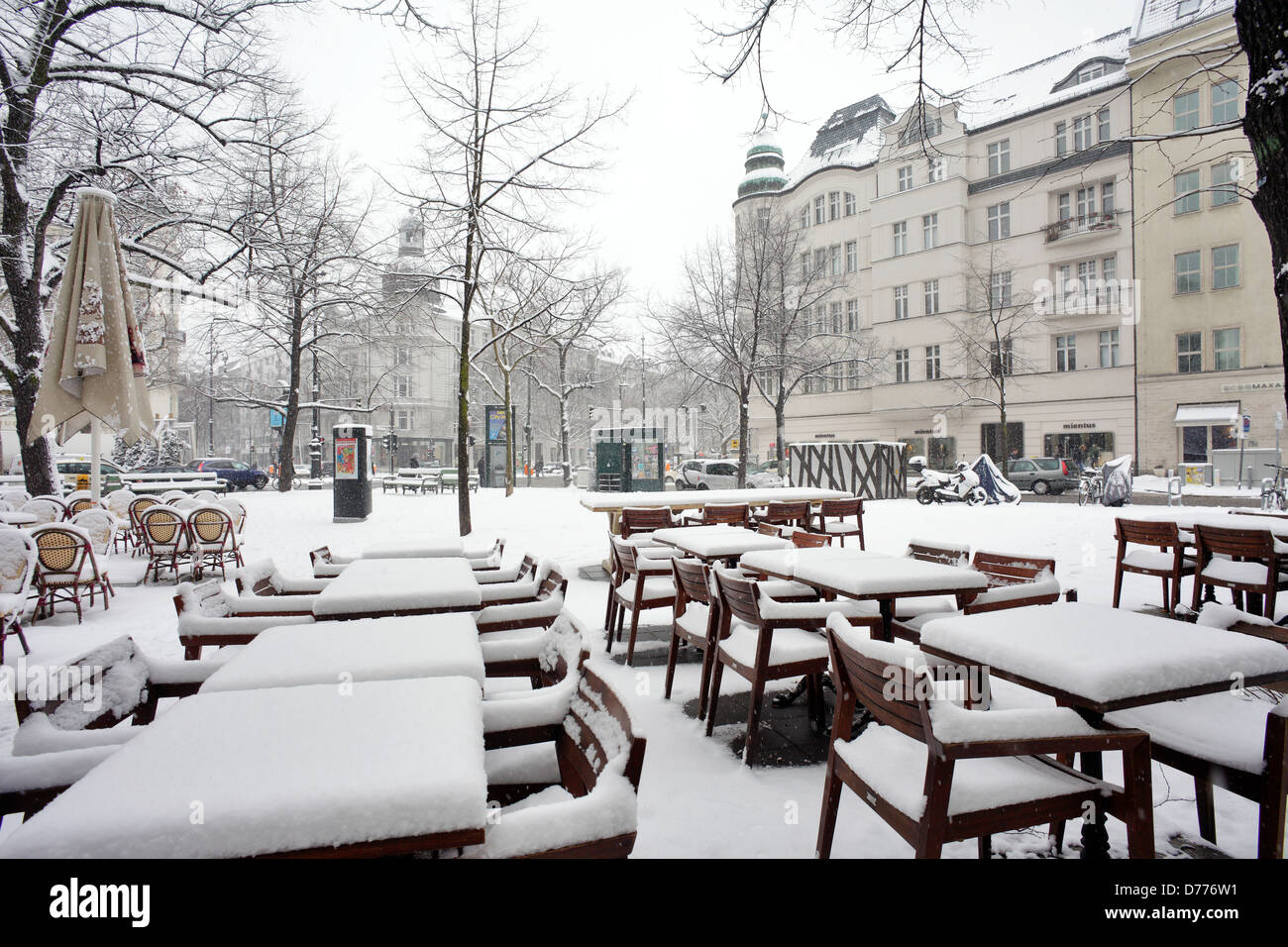 Berlin, Germany, snowedin furniture of a street cafes on the Place