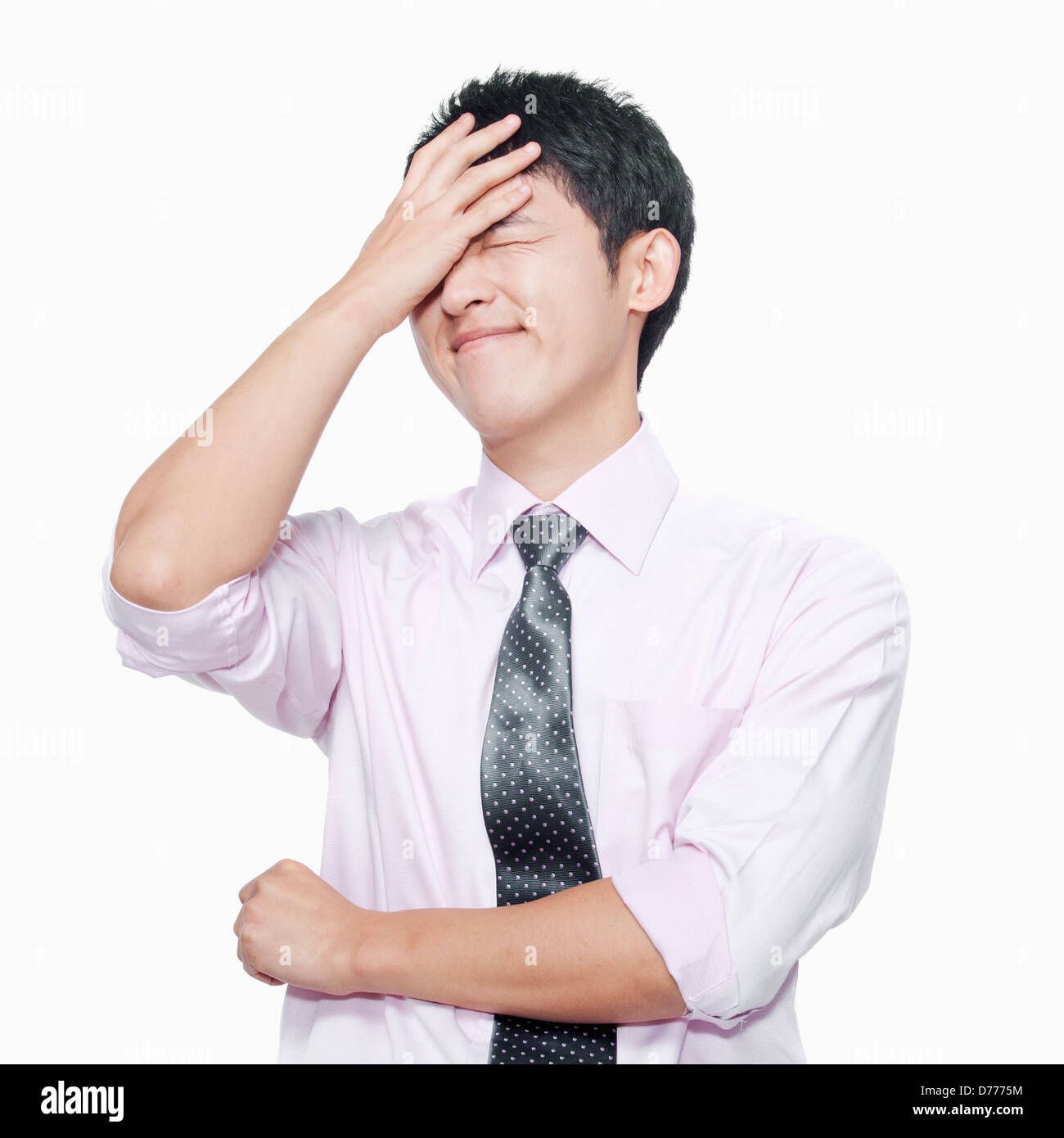 Young man with hand on forehead Stock Photo