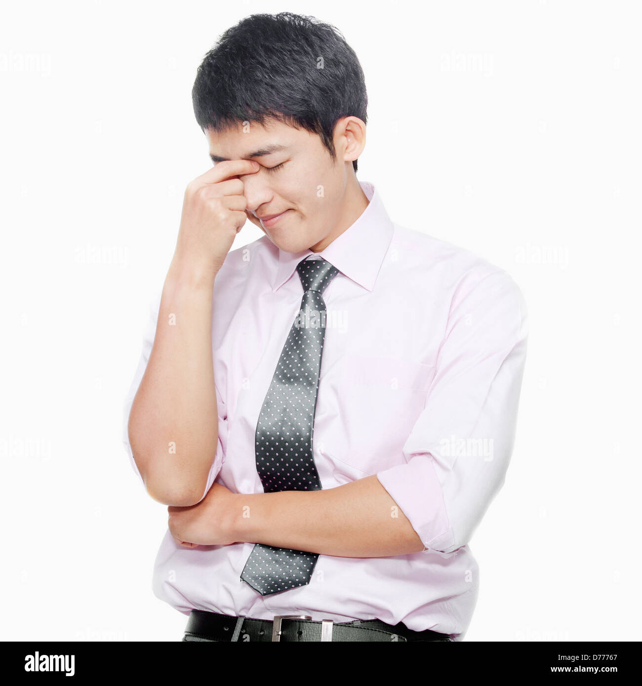 Young man with eyes closed thinking Stock Photo