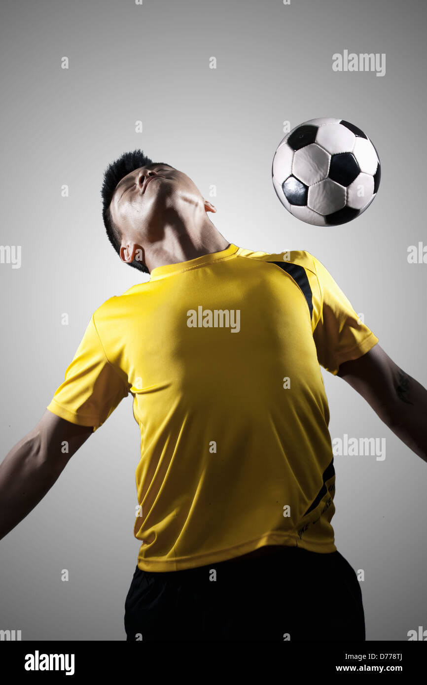 Soccer Player Chest Bumping a Ball Stock Photo Alamy