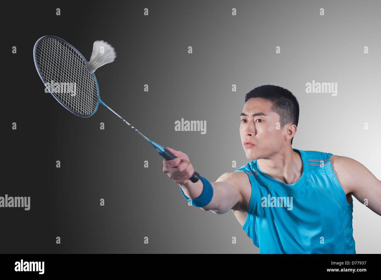 Young man playing badminton, hitting Stock Photo Alamy