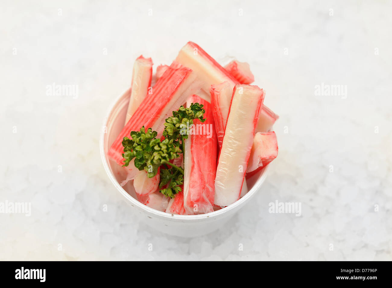 Crab sticks on a bed of ice. Stock Photo