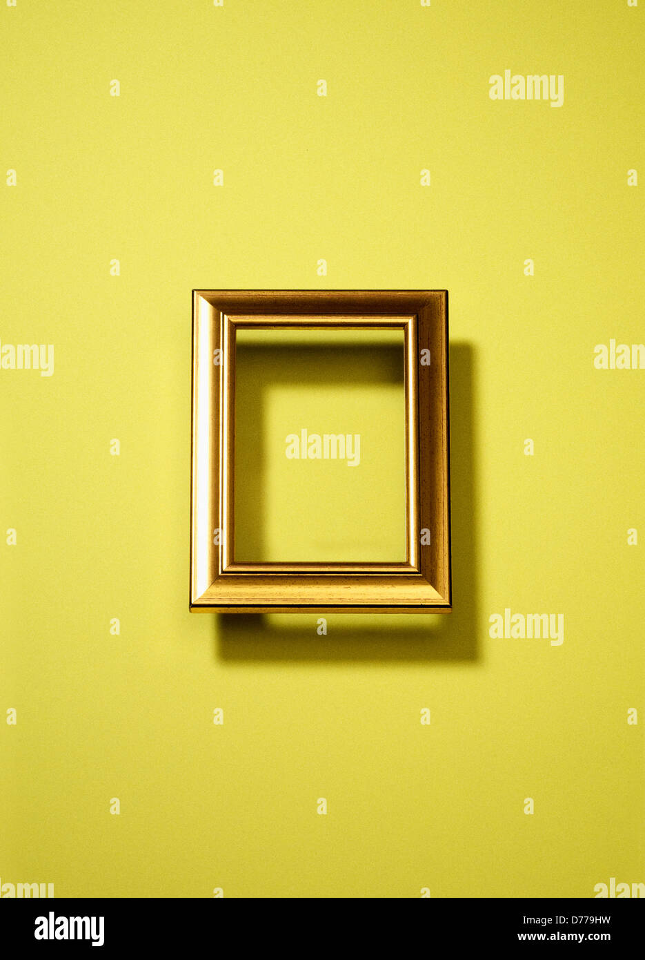 Hamburg, Germany, an empty picture frame on a yellow wall Stock Photo