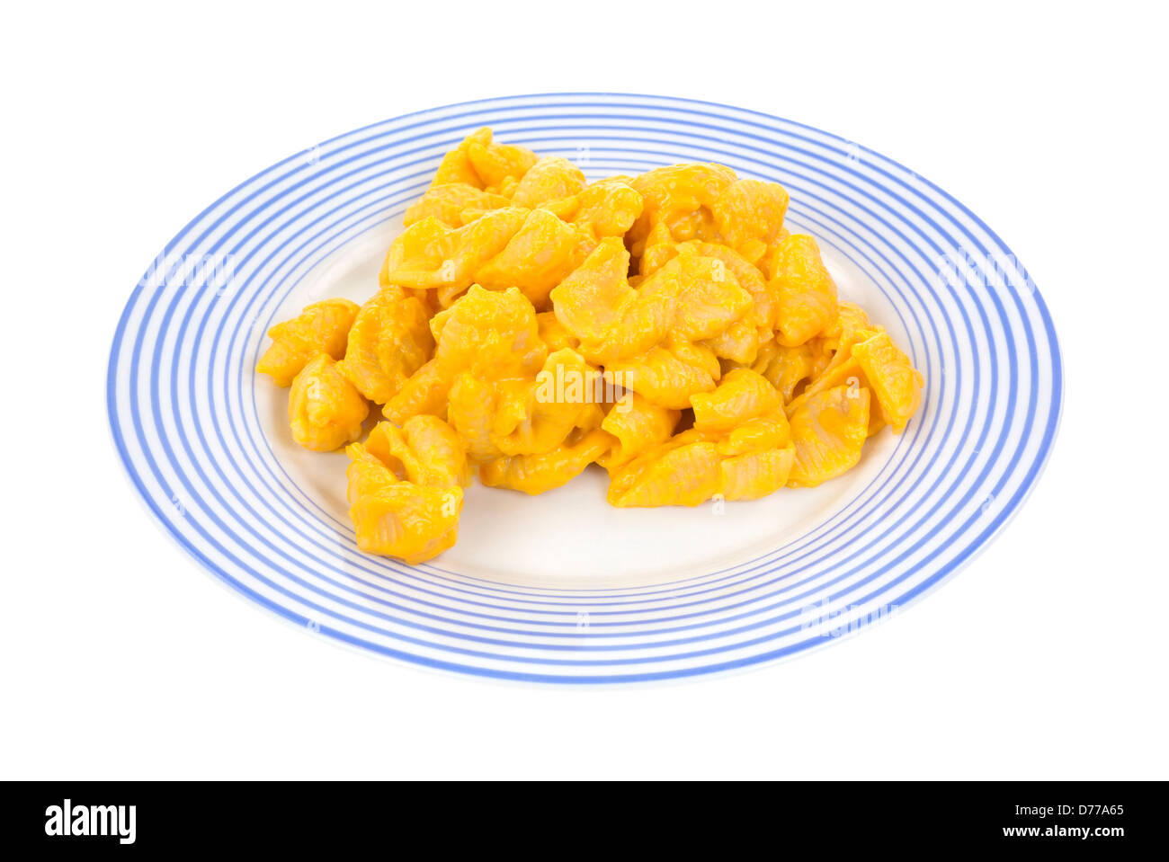 A serving of cheesy pasta shells on a blue striped plate. Stock Photo