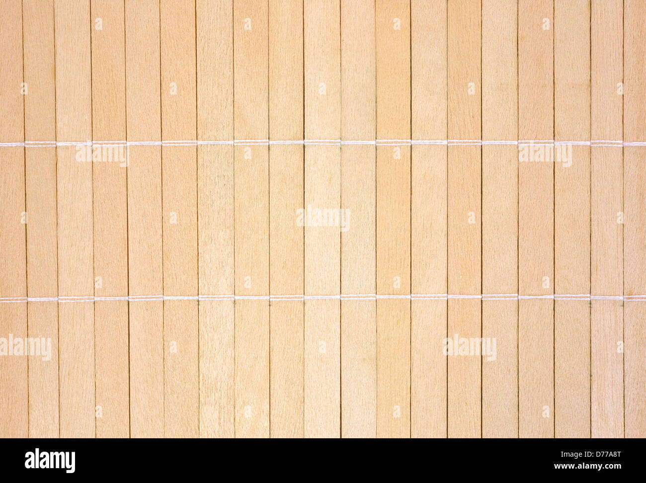 A background of wood slats that have been joined together with thread. Stock Photo