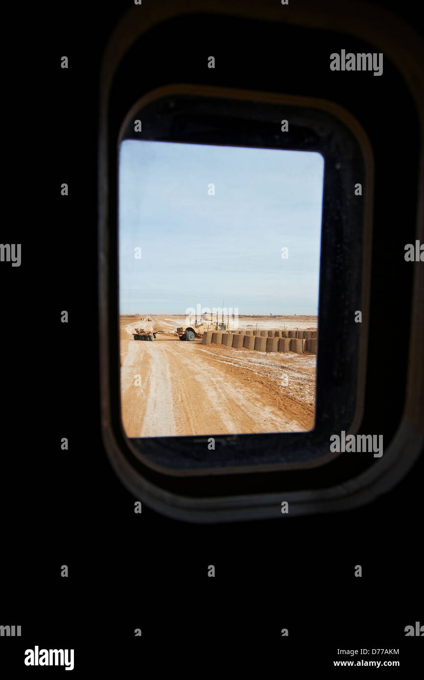 View Through Small Bullet Proof Glass Window MRAP or Mine Resistant Ambush Protected Vehicle Another MRAP Mine Roller Helmand Stock Photo