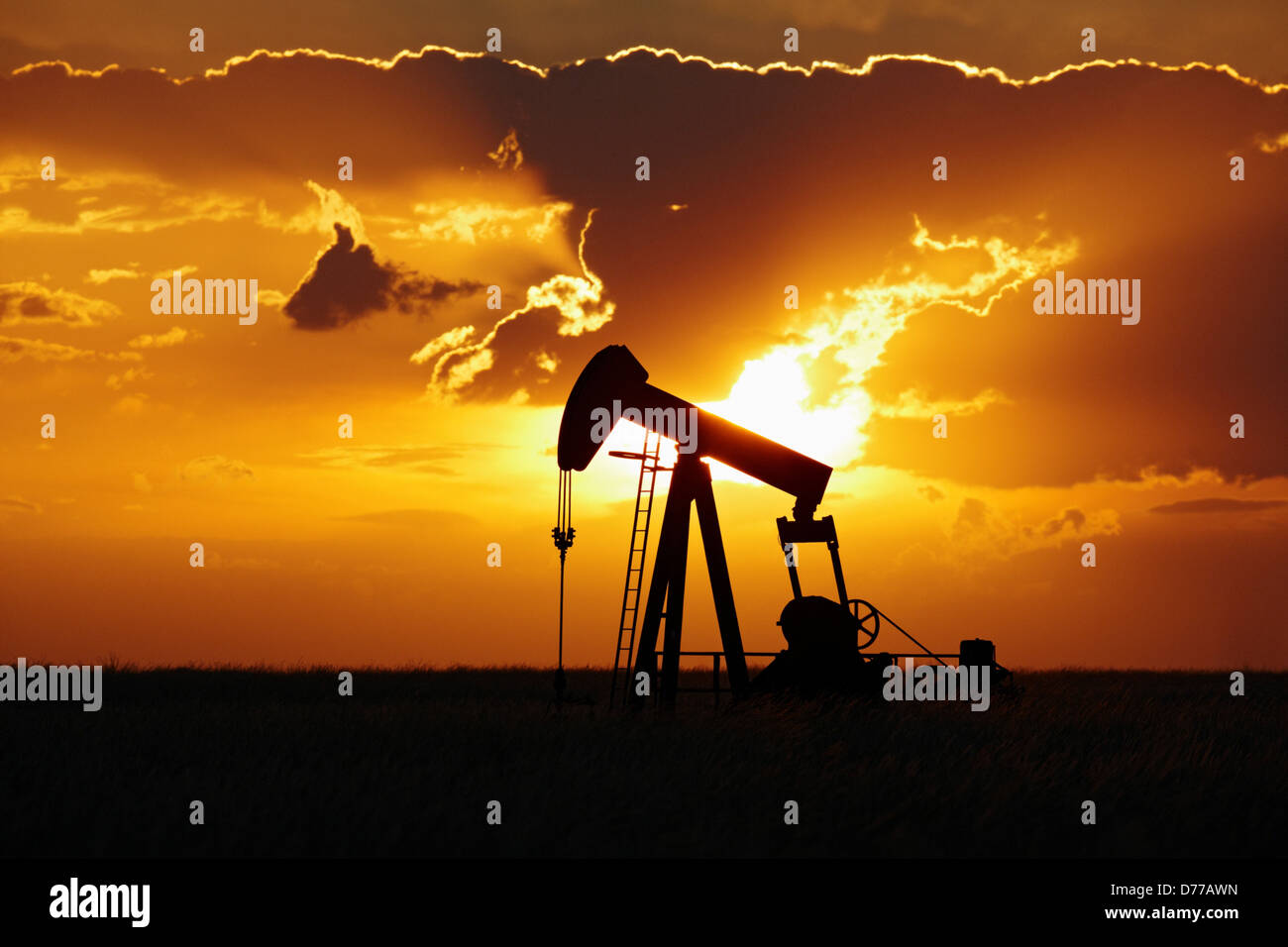Oil Well Pump Jack at Sunset Stock Photo Alamy