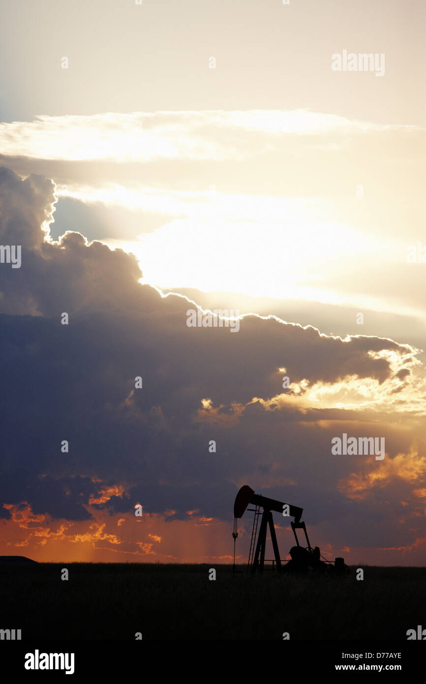 Oil Well Pump Jack at Sunset Stock Photo