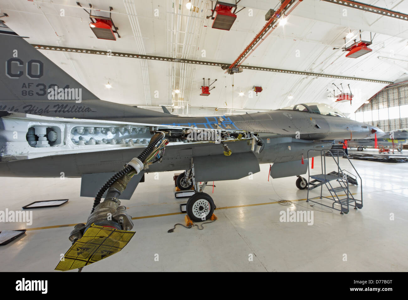 F-16 in Maintenance Hangar Showing Disassembled Wing Stock Photo