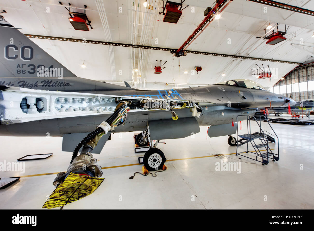 F-16 in Maintenance Hangar Showing Disassembled Wing High Dynamic Range or HDR Image Stock Photo