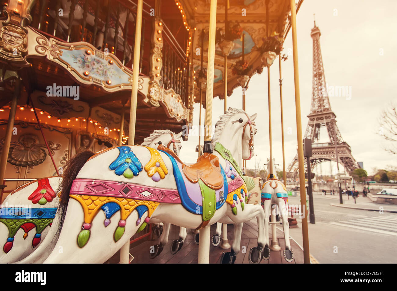View of the carousel and the Eiffel Tower at sunset Stock Photo