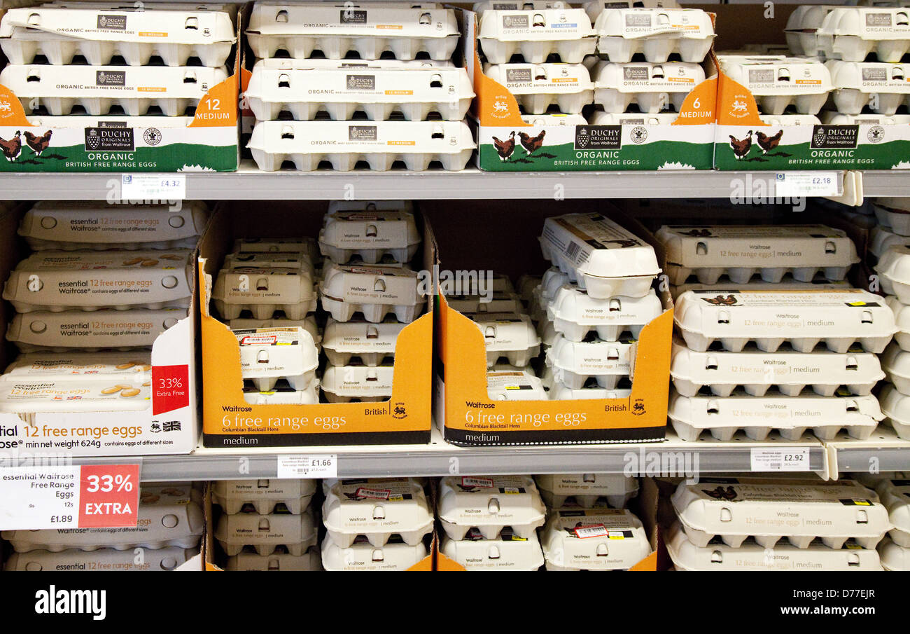 Boxes of eggs for sale on a supermarket shelf, Waitrose UK Stock Photo