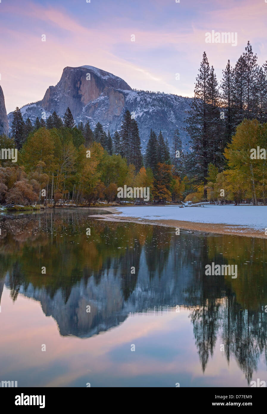 Yosemite National Park, CA Half Dome (8842 ft) reflected in the Merced River at dawn after a snowfall Stock Photo