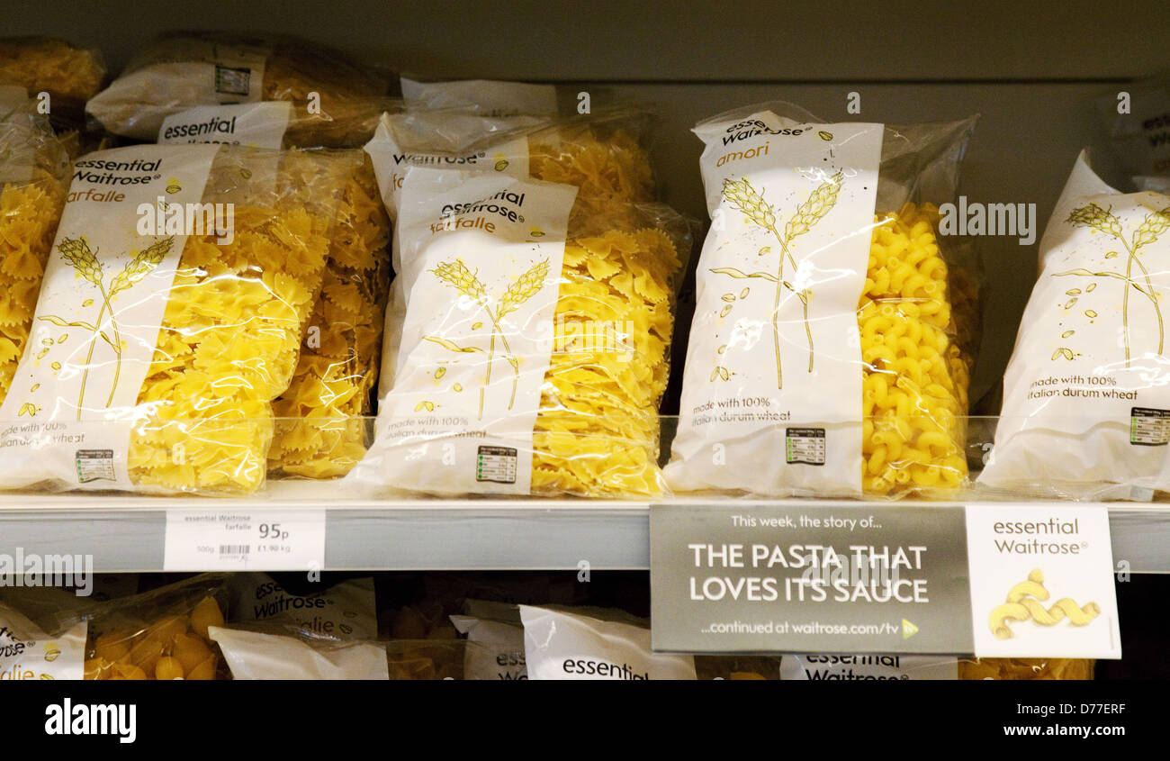 Bags of pasta on the supermarket shelves, Essential Waitrose brand, UK Stock Photo